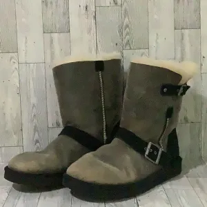 - Ugg women’s black side buckles distressed warm fuzzy winter boots size 8