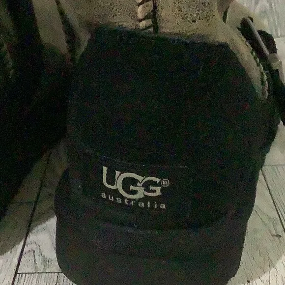 - Ugg women’s black side buckles distressed warm fuzzy winter boots size 8