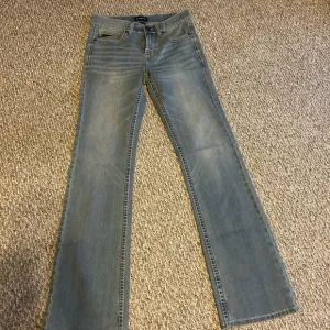 Blue Bootcut Jeans with Distressed Medium Wash (Rank 45)