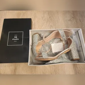 David's Bridal Silver Heels with Ankle Strap and Stiletto Design