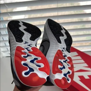 Nike Athletic Shoes with Red and Blue Soles