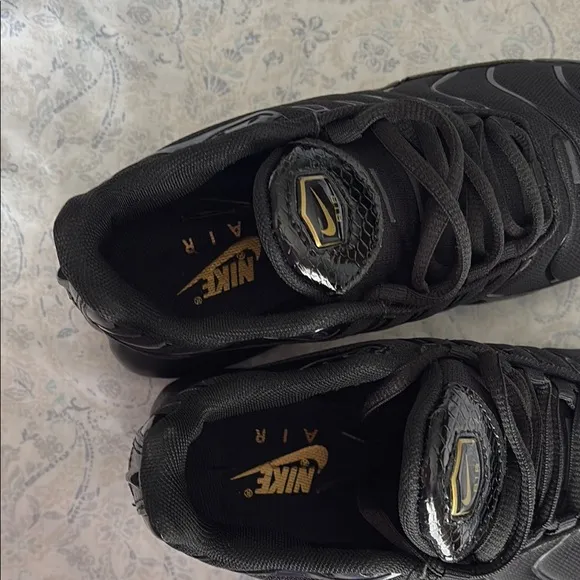 Nike Kid’s Black and Gold Sneakers