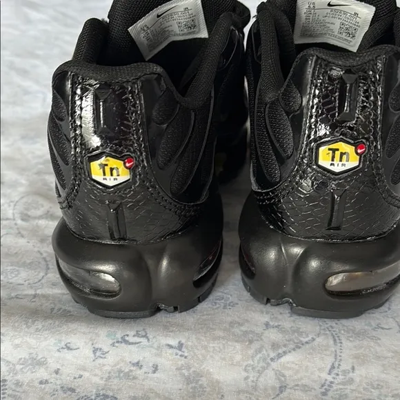 Nike Kid’s Black and Gold Sneakers