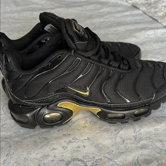 Nike Kid’s Black and Gold Sneakers