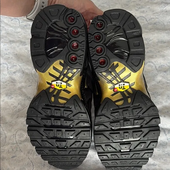 Nike Kid’s Black and Gold Sneakers