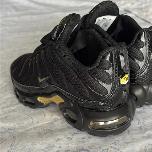 Nike Kid’s Black and Gold Sneakers