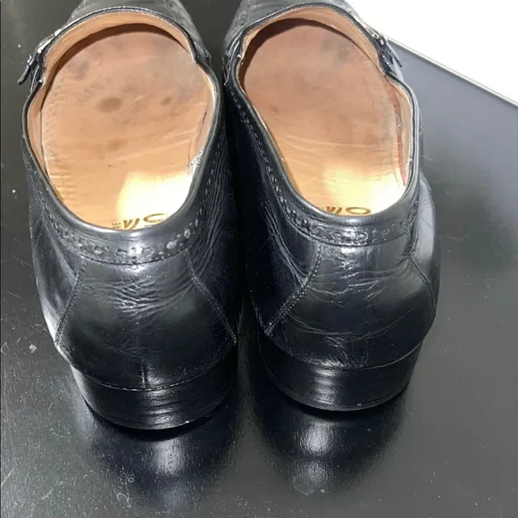 Salvatore Ferragamo's black leather loafers.