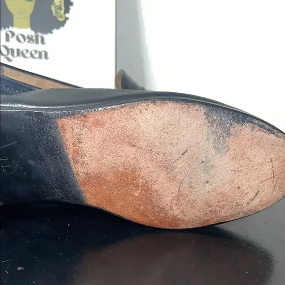 Salvatore Ferragamo's black leather loafers.