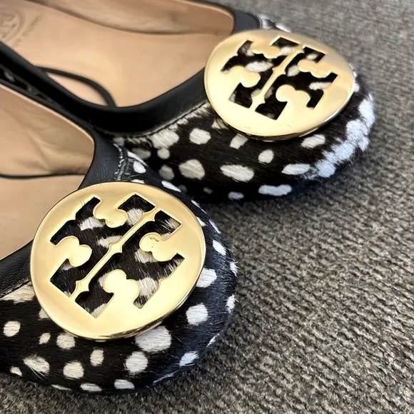 Tori Burch Reva Black/WhiteSpotted Calf Hair Gold Logo SlipOn Ballet Flats